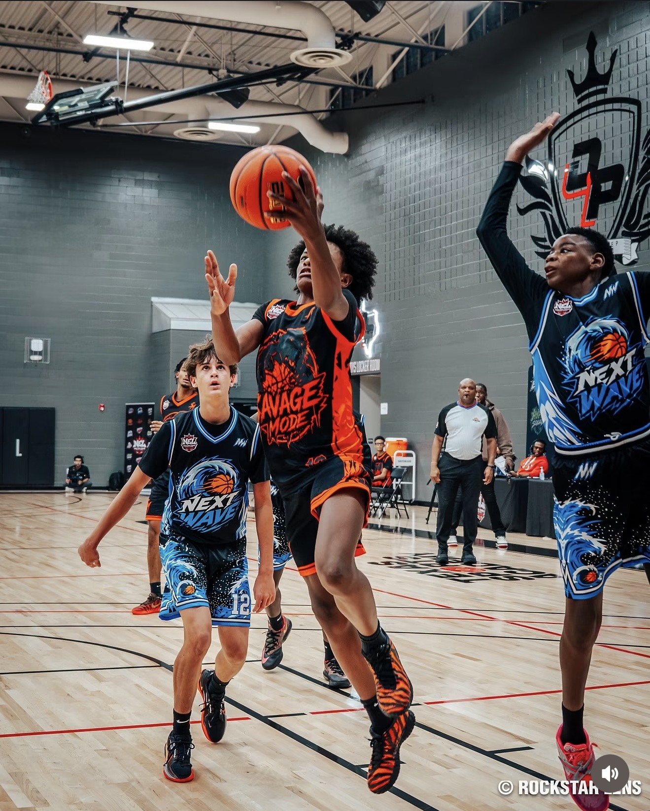 Quentin Johnson attacking the basket for a layup in his Savage Mode uniform